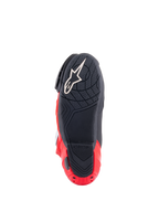 Alpinestars Honda Supertech R Boots, Sole View, Black and Bright Red, featuring a textured rubber compound for grip, white Astar logo on the forefoot, and red heel plate slider, high-performance racing motorcycle footwear.