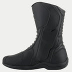 Alpinestars Origin Drystar® Boots, Black Motorcycle Touring Boots, side profile view of the medial side showing the entry system flap, microfiber upper with front and rear accordion flex zones, durable waterproof design for road and adventure riding