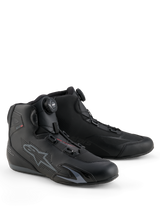 Alpinestars Celer Shoes, Motorcycle Riding Shoes, Black and Dark Gray, featuring integrated Rotor Closure System for precision fit, technical microfiber construction with perforated star logo, low-profile sport design for racing and street riding