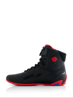 Alpinestars Honda Faster-4 Shoes, Motorcycle Riding Shoes, Black and Red, side profile view, featuring a bright red sole and hexagonal ankle protector, high-top sneaker style with lace closure and hook-and-loop strap, 'Alpinestars Protects' branding, sleek performance footwear for road riding