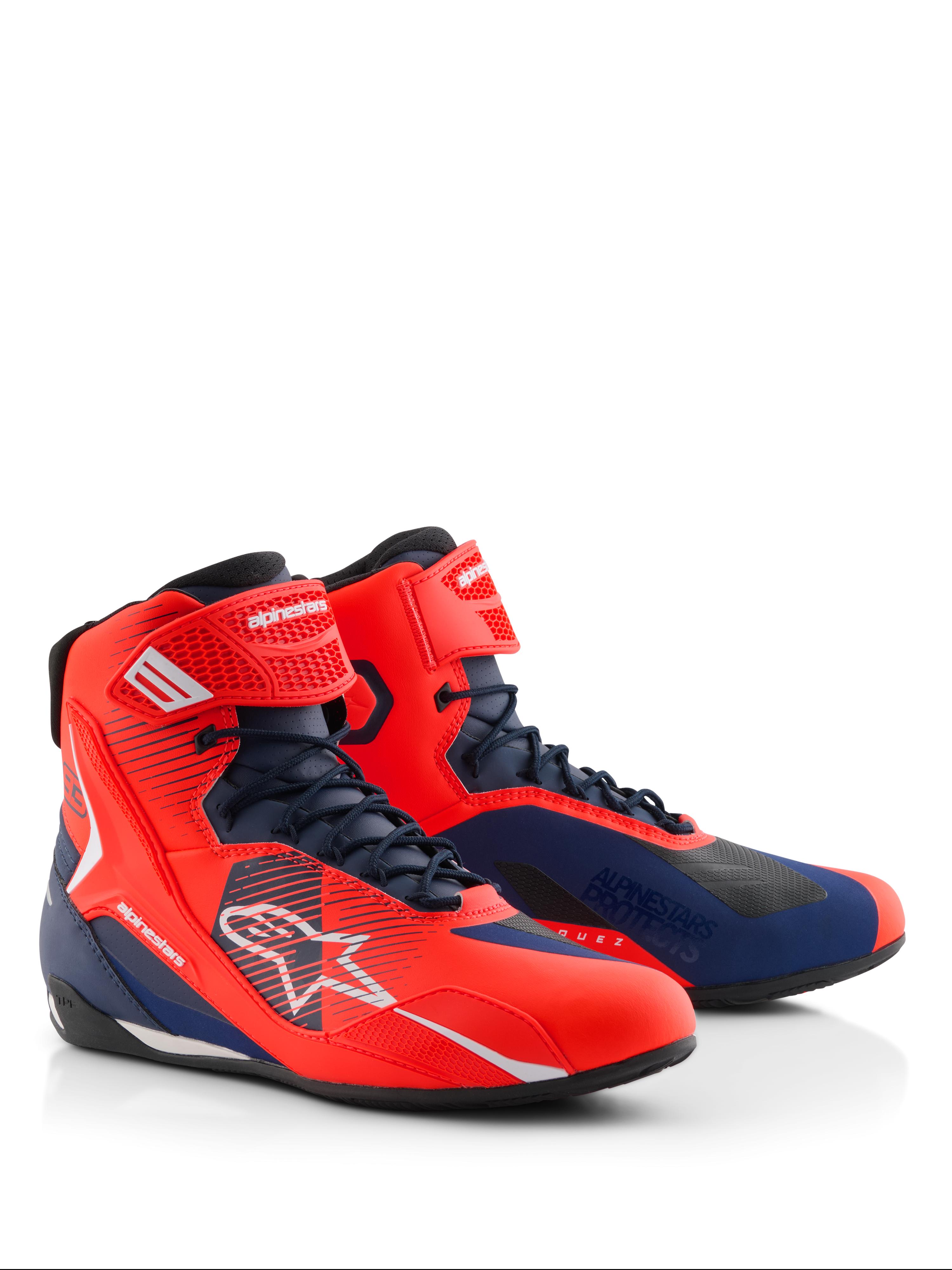 Alpinestars MM93 Faster-4 Shoes, motorcycle riding shoes in Red Fluo and Dark Blue, featuring a lace-up closure with a top ankle strap, white Alpinestars logos, and technical microfiber construction for road and sport riding.