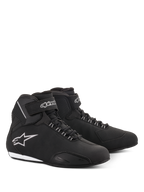 Alpinestars Women Stella Sektor Waterproof Shoes, Motorcycle Riding Shoes, Black and Silver, sleek microfiber upper with lace-up closure and velcro ankle strap, featuring a silver Alpinestars star logo on the side and a slim rubber sole.