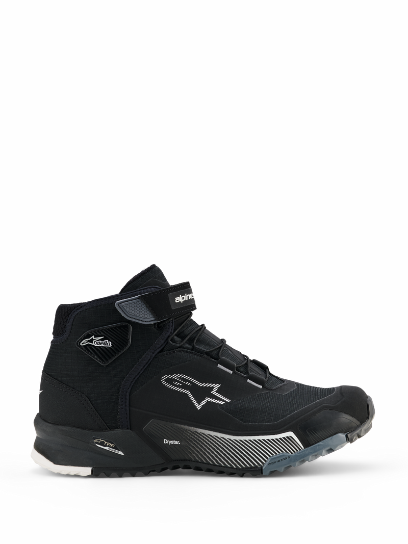 Alpinestars CR-X Women's Drystar Riding Shoes, Black high-top motorcycle sneakers, side view of women's urban riding footwear with lace-up closure and Velcro ankle strap, white Alpinestars star logo, 'Drystar' and 'TPF' branding on the midsole, rugged rubber sole with white and gray patterns.