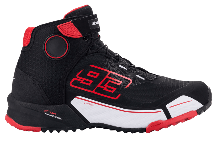 Alpinestars MM93 CR-X Drystar® Riding Shoe, Black Red White, side profile view of a protective motorcycle shoe, featuring bold red Marc Marquez '93' branding, white midsole panel, and red outsole accents, sporty sneaker-inspired design