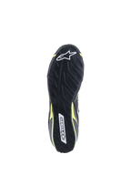 Alpinestars Tech-1 T V3 Shoes FIA, Outsole view, Black with Yellow Fluo accents, asymmetric tire-tread inspired rubber sole, featuring Alpinestars logos and textured pattern for pedal sensitivity and grip.