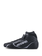 Alpinestars Tech-1 T V3 Shoes FIA, Auto Racing Shoes, Black and Silver, side profile view, full bovine leather construction with silver ASTARS branding, adjustable hook-and-loop strap, and elastic fireproof collar.