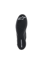 Alpinestars Supertech Shoes, Auto Racing Shoes, Black, bottom view of the ultra-thin rubber outsole with white star logo and alpinestars wordmark, featuring an asymmetric tread pattern for pedal sensitivity and grip