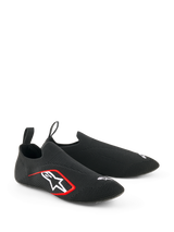 Alpinestars Tech Gaming Shoes, Sim-Racing Footwear, Black, featuring a seamless knitted stretch upper, white embroidered logo with red accents, low-profile sock-like design with rear pull tabs, optimized for pedal sensitivity
