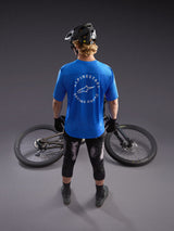 Alpinestars A-Dura Air Short Sleeve Jersey in bright blue with large white 'Racing Ahead' back graphic, worn by a rider.