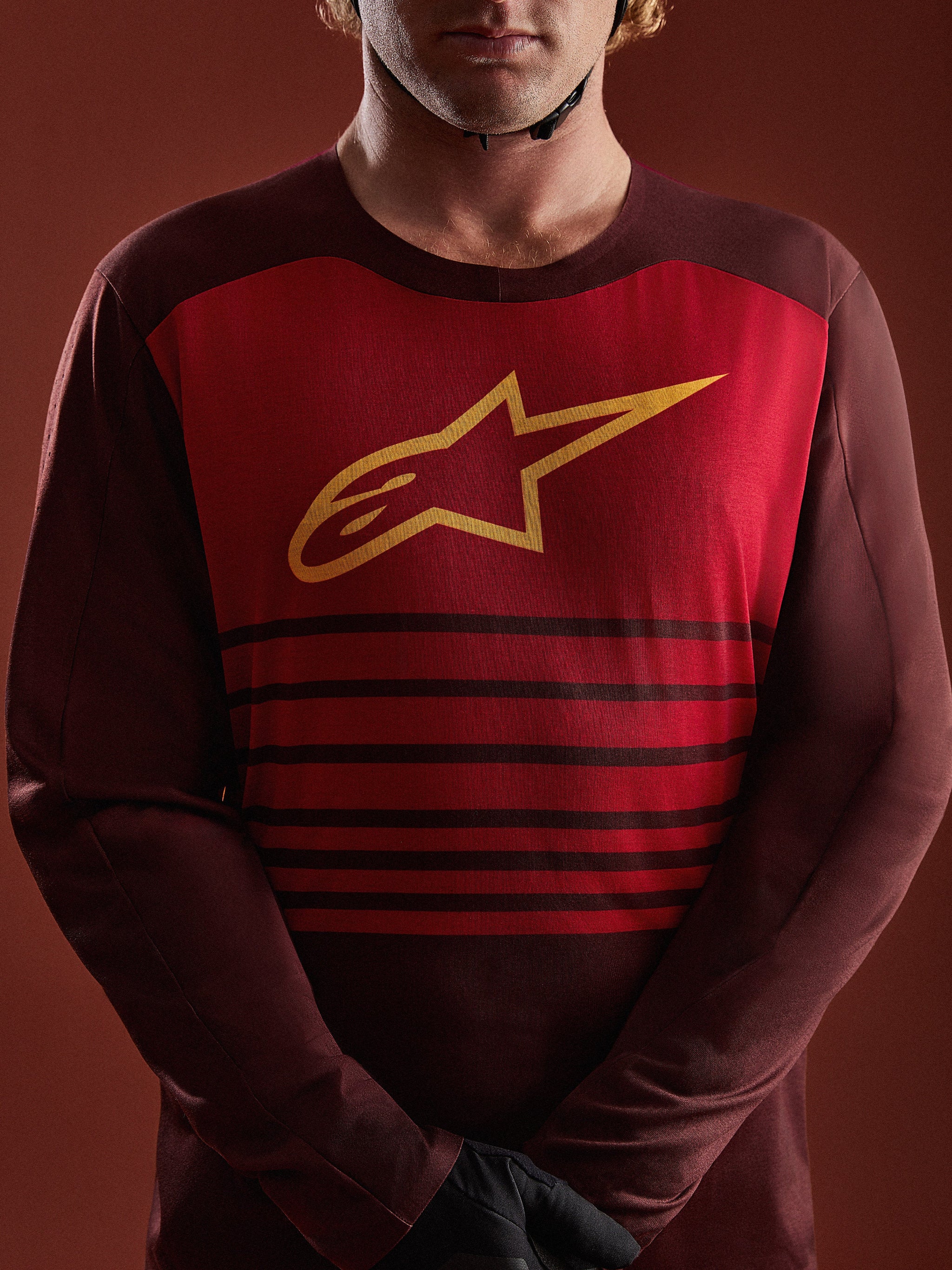A-Dura Elite Long Sleeve Jersey in Bordeaux, featuring a red chest panel with yellow A-star logo and horizontal stripes.