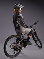 Gray A-Dura Race Long Sleeve Jersey on a mountain biker, featuring bold Alpinestars logos and performance stretch fabric.