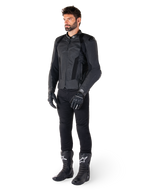 Alpinestars Missile V3 Airflow Leather Jacket, Black, worn by a rider with matching black pants, gloves, and boots, featuring perforated bovine leather for maximum ventilation and DFS shoulder armor, premium sport motorcycle gear