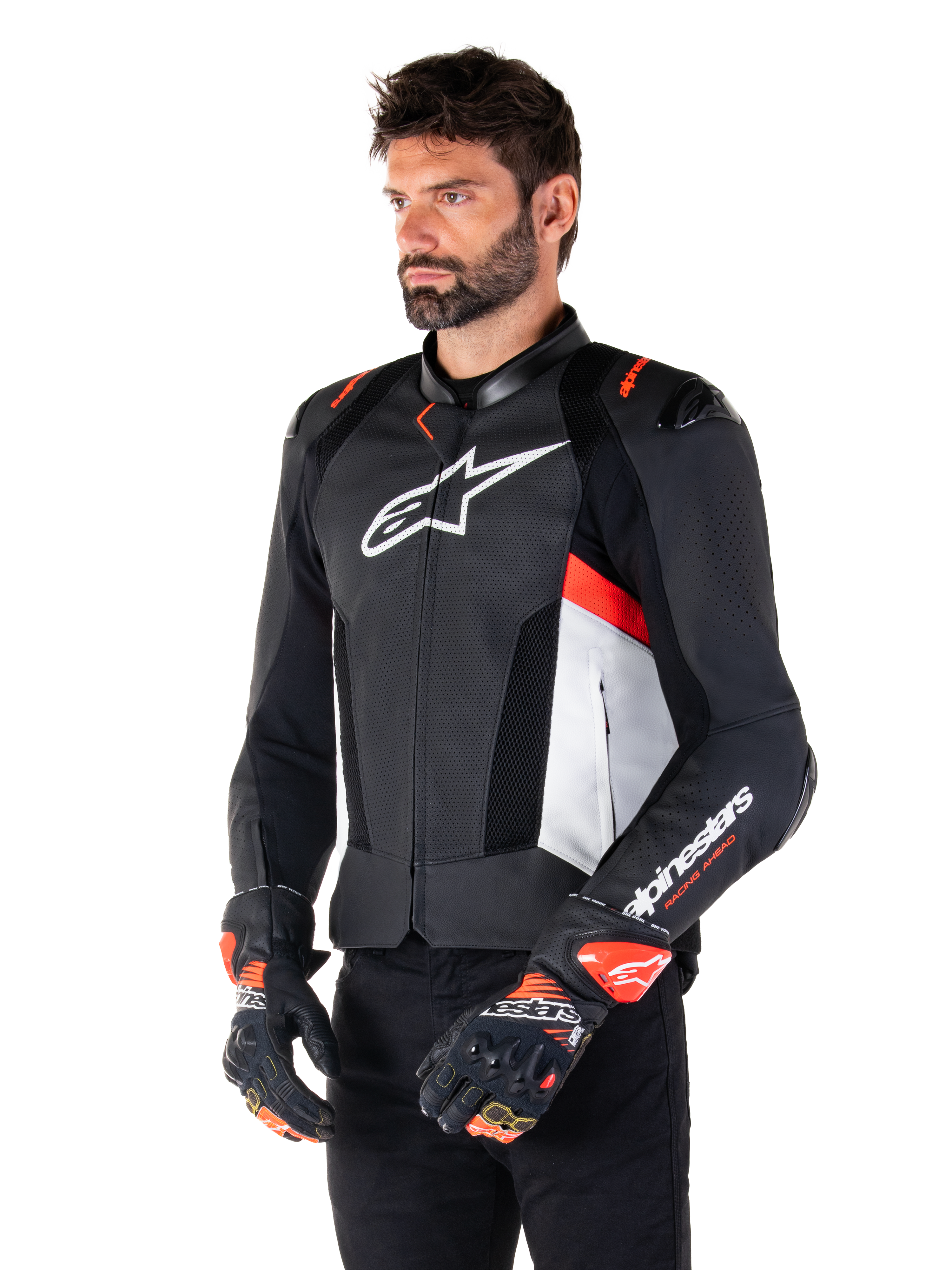 Alpinestars Missile V3 Airflow Leather Jacket, Black White and Red Fluo, Racing Sport Motorcycle Jacket, worn by model with matching gloves, featuring perforated leather panels, large white chest logo, and black shoulder sliders.