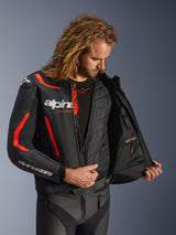 Alpinestars GP Force V2 Leather Jacket in Black and Red Fluo, detailed interior view on model showing the detachable thermal vest and waterproof inner pocket, premium leather construction for sport riding protection.