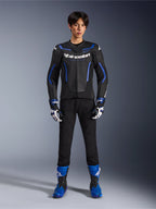 Alpinestars GP Force V2 Airflow Leather Jacket in Black Metallic Blue, worn with matching racing gloves, black pants, and blue boots, professional sport motorcycle riding gear, full-body studio shot