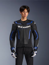 Alpinestars GP Force V2 Airflow Leather Jacket, Black Metallic Blue, motorcycle jacket with perforated leather and blue accents, worn by a model with matching racing gloves and black pants, professional sport riding gear