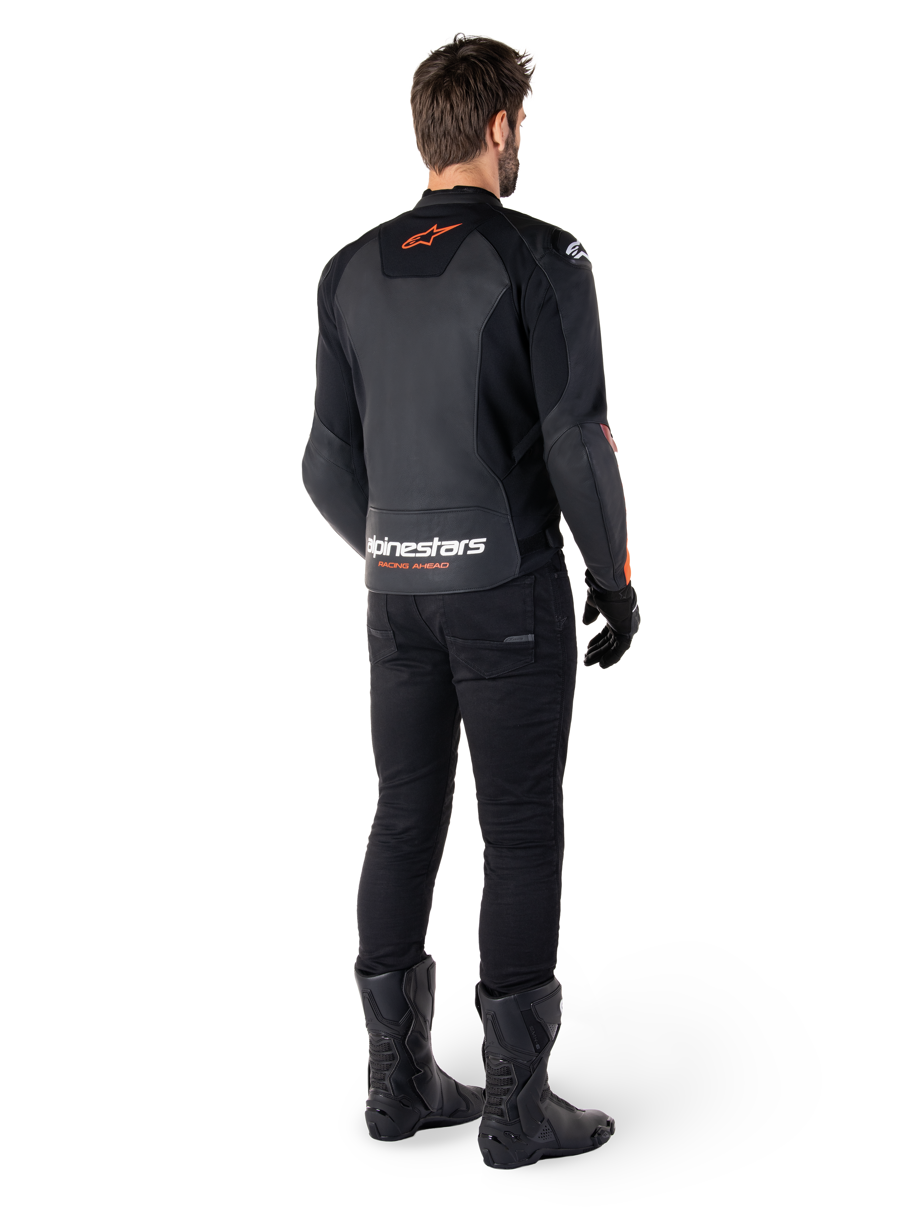 Alpinestars Faster V3 Leather Jacket, Sport Motorcycle Jacket, Black and Red Fluo, rear view worn with black pants and black boots, featuring 'alpinestars RACING AHEAD' text on the lower back and a small red star logo, sleek sport-fit leather construction