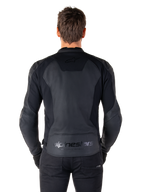 Rear view of a man wearing the Alpinestars Faster V3 Leather Jacket in Black Black, featuring premium leather panels and flexible stretch inserts, subtle 'alpinestars' and 'RACING AHEAD' branding on the lower back, athletic sport fit for motorcycle riding.