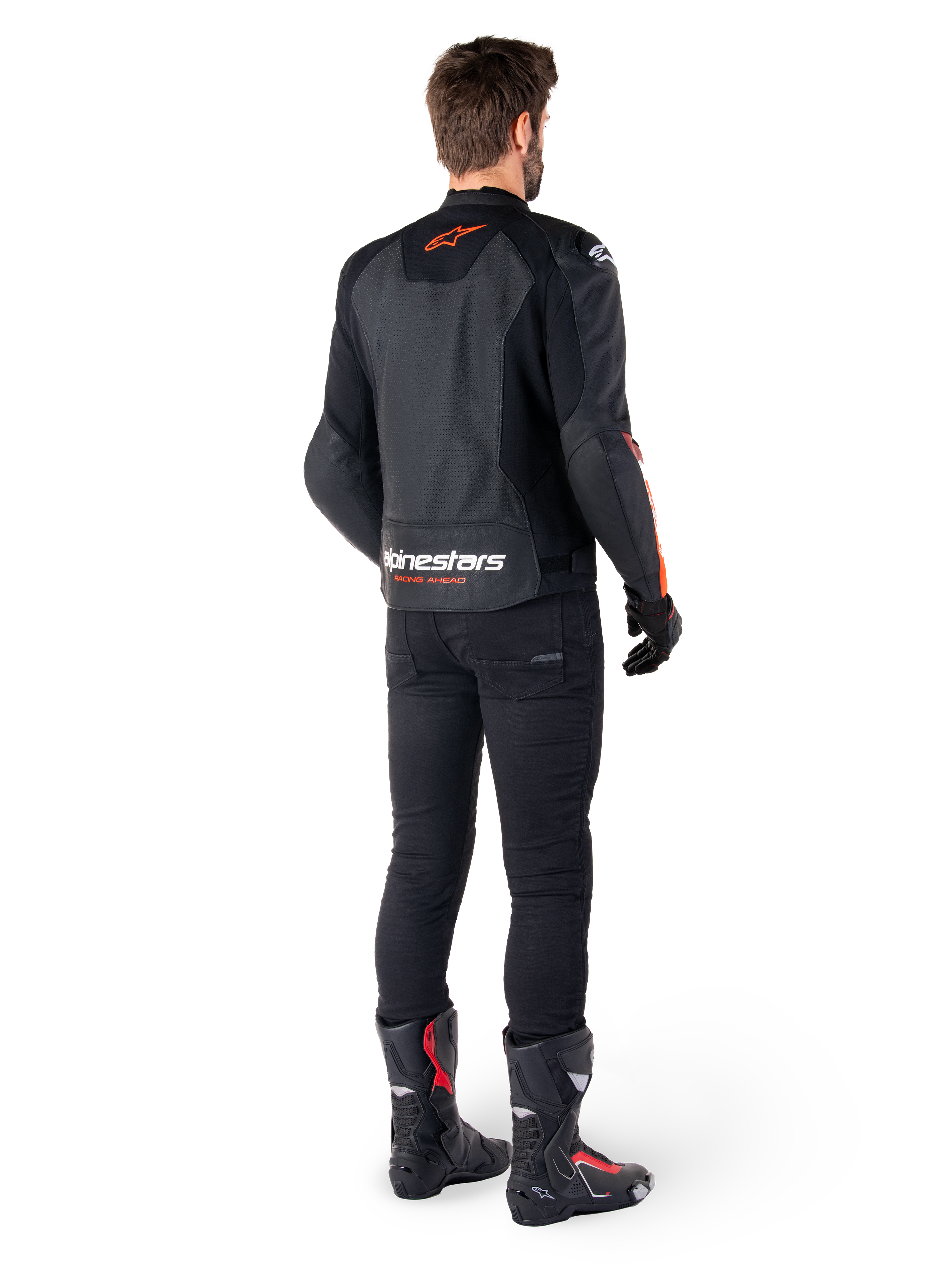 Alpinestars Faster V3 Airflow Leather Jacket, Black and Red Fluo, seen from behind on a rider, featuring perforated leather panels and bold branding, worn with black pants and motorcycle boots, sport riding attire.