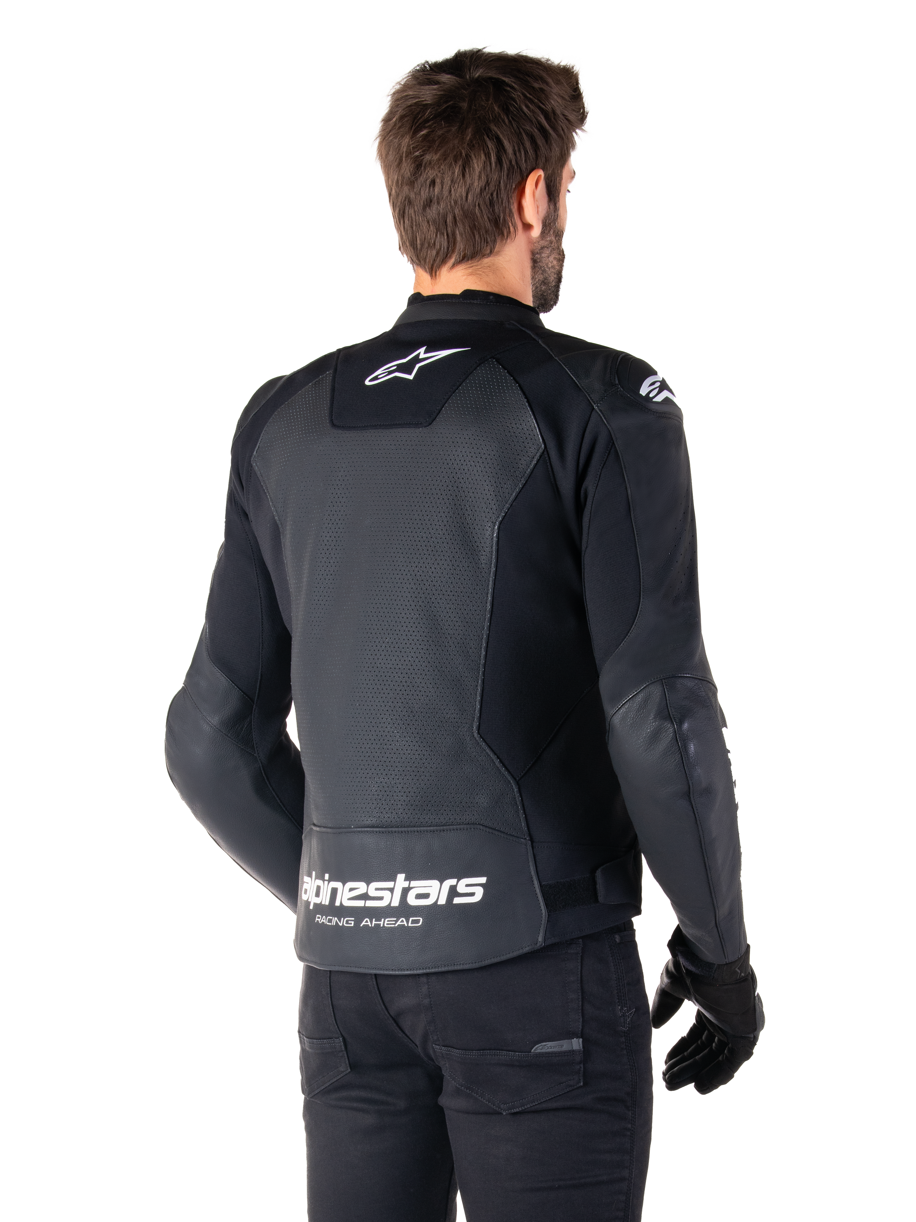 Alpinestars Faster V3 Airflow Leather Jacket, Black and White, rear view on a model, featuring perforated leather back for ventilation, white Astars logos on the upper back and lower waist with 'Racing Ahead' text, sporty design with stretch panels for motorcycling.