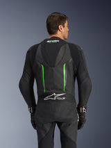 Alpinestars GP Force V2 Leather Suit - 1Piece, Black and Green, back view featuring aerodynamic speed hump, Tech-Air Ready branding, perforated leather zones, and accordion stretch panels for motorcycle racing