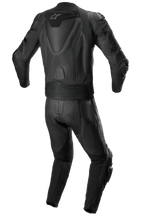 Alpinestars Missile V2 2-Piece Leather Suit, Racing Leather Suit, All Black, rear view showing aerodynamic back hump with white star logo, accordion stretch panels at the waist and shoulders, and perforated leather detailing for performance motorcycle riding