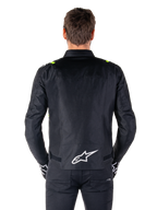 Alpinestars T-SPS V2 Waterproof Jacket, Back View, Black with Yellow Fluo accents on shoulders and white star logo on the lower back, Textile motorcycle jacket with a sport silhouette, Worn by male model.