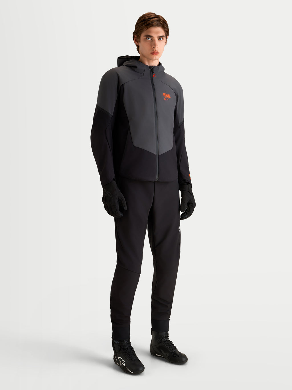 Alpinestars Aeroshell Waterproof Jacket, Men's Motorcycle Softshell Jacket in Black and Dark Gray, featuring CE-certified protection and an adaptive stretch shell, worn by a model