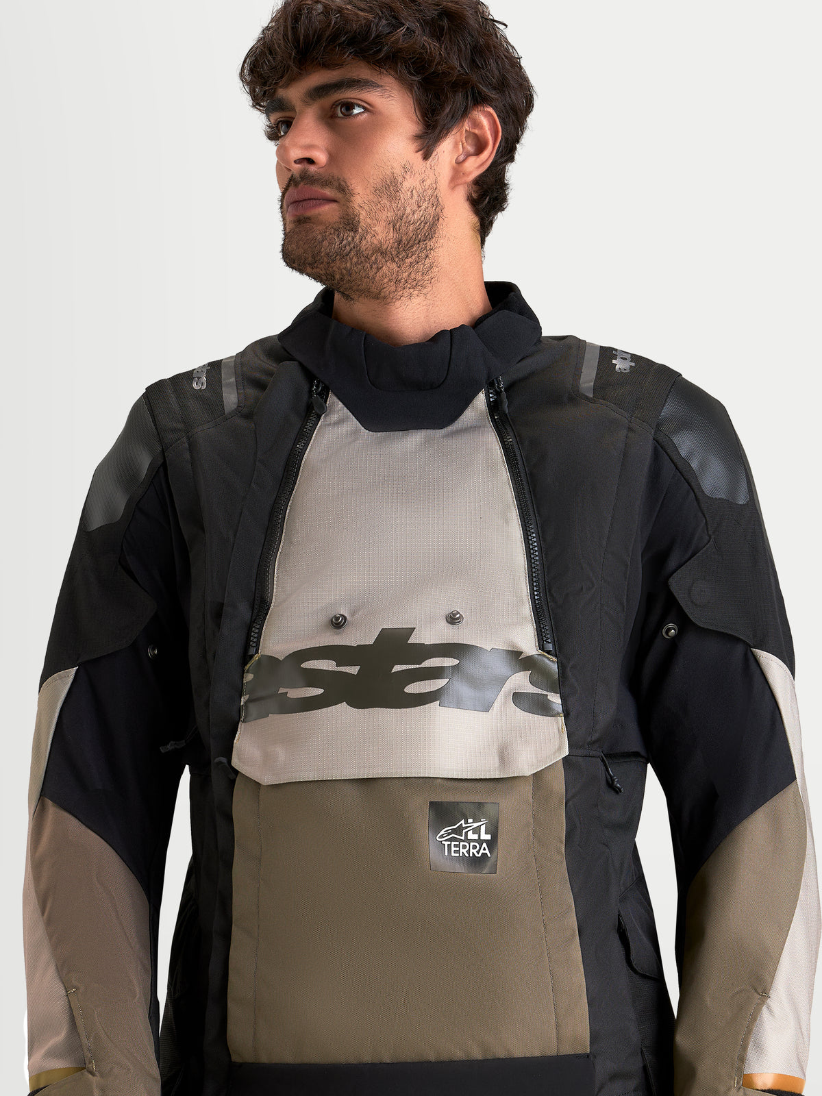 Alpinestars Harok V2 Drystar Jacket, Men's adventure motorcycle jacket in aluminum, walnut, and black, featuring a modular waterproof design and front kangaroo pocket detail