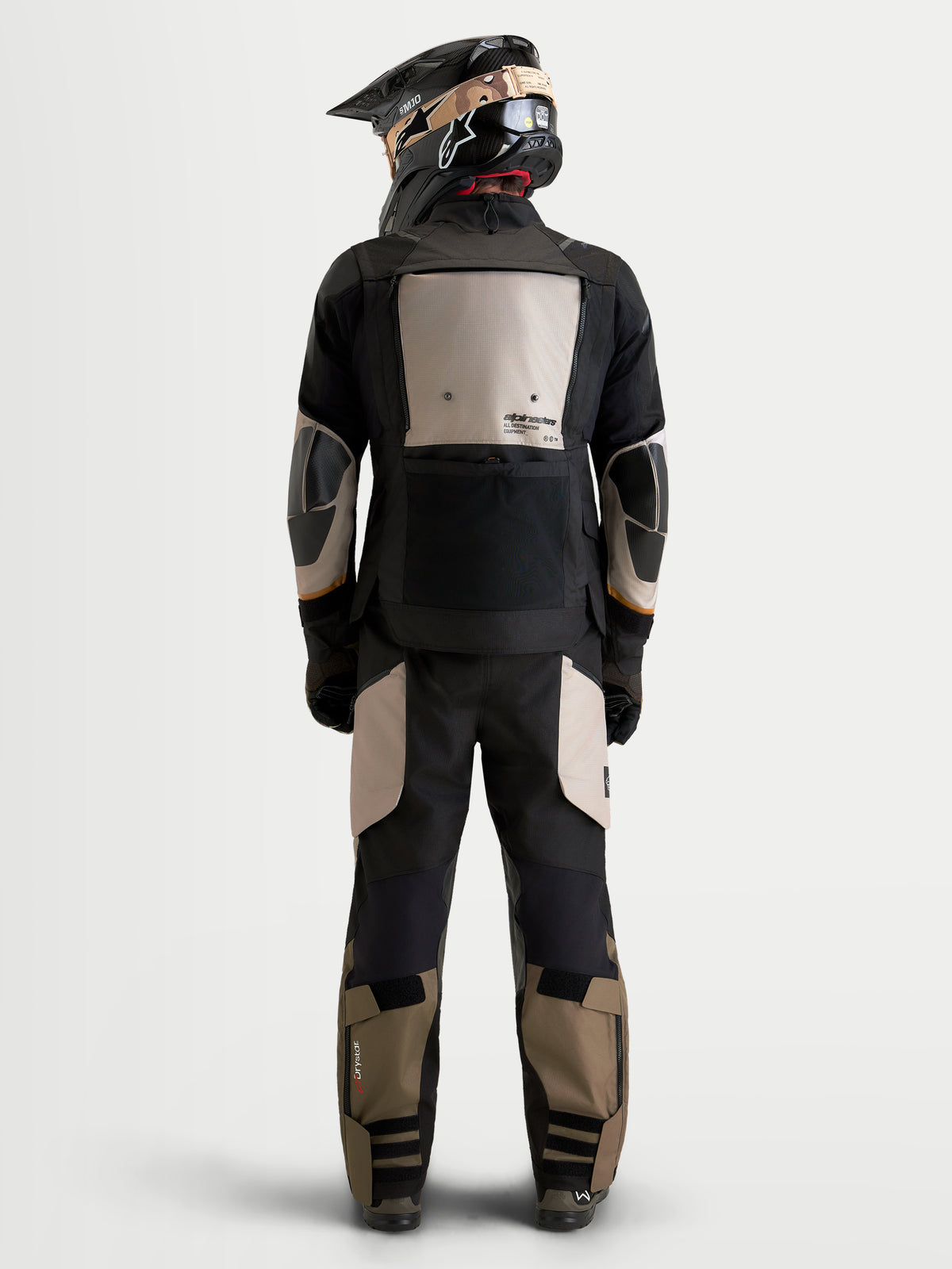 Alpinestars Harok V2 Drystar Jacket, Men's Adventure Motorcycle Jacket, Aluminum, Walnut, and Black, rear view of a rider wearing the all-terrain jacket and matching gear with a helmet