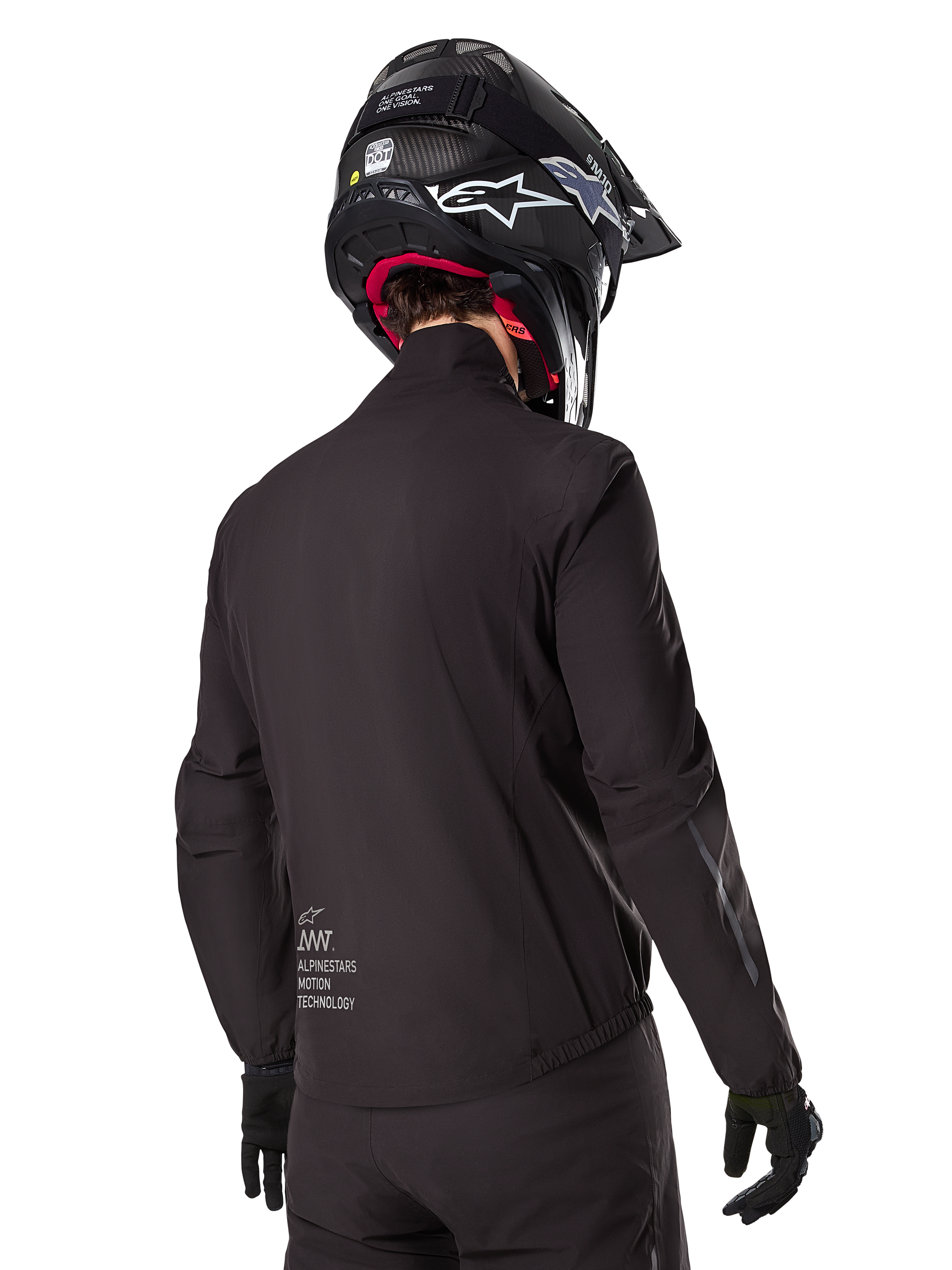 Alpinestars AMT-8 Stretch Drystar® XF Liner, Black Waterproof Jacket Liner, rear view on a rider wearing a black helmet and gloves, featuring Alpinestars Motion Technology branding on the lower back, minimalist and functional design for adventure riding.