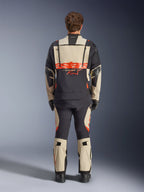 Alpinestars Halo Pro Drystar® XF Laminated Jacket, Adventure Motorcycle Jacket, Mastic Black with orange logo, rear view showing large back branding and modular ventilation zippers, worn with matching adventure pants for all-terrain performance