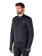 Alpinestars Clayton WR Jacket, Black, urban textile motorcycle jacket with quilted shoulder and forearm details, slim-fit design, matte finish, worn by a rider with black gloves.
