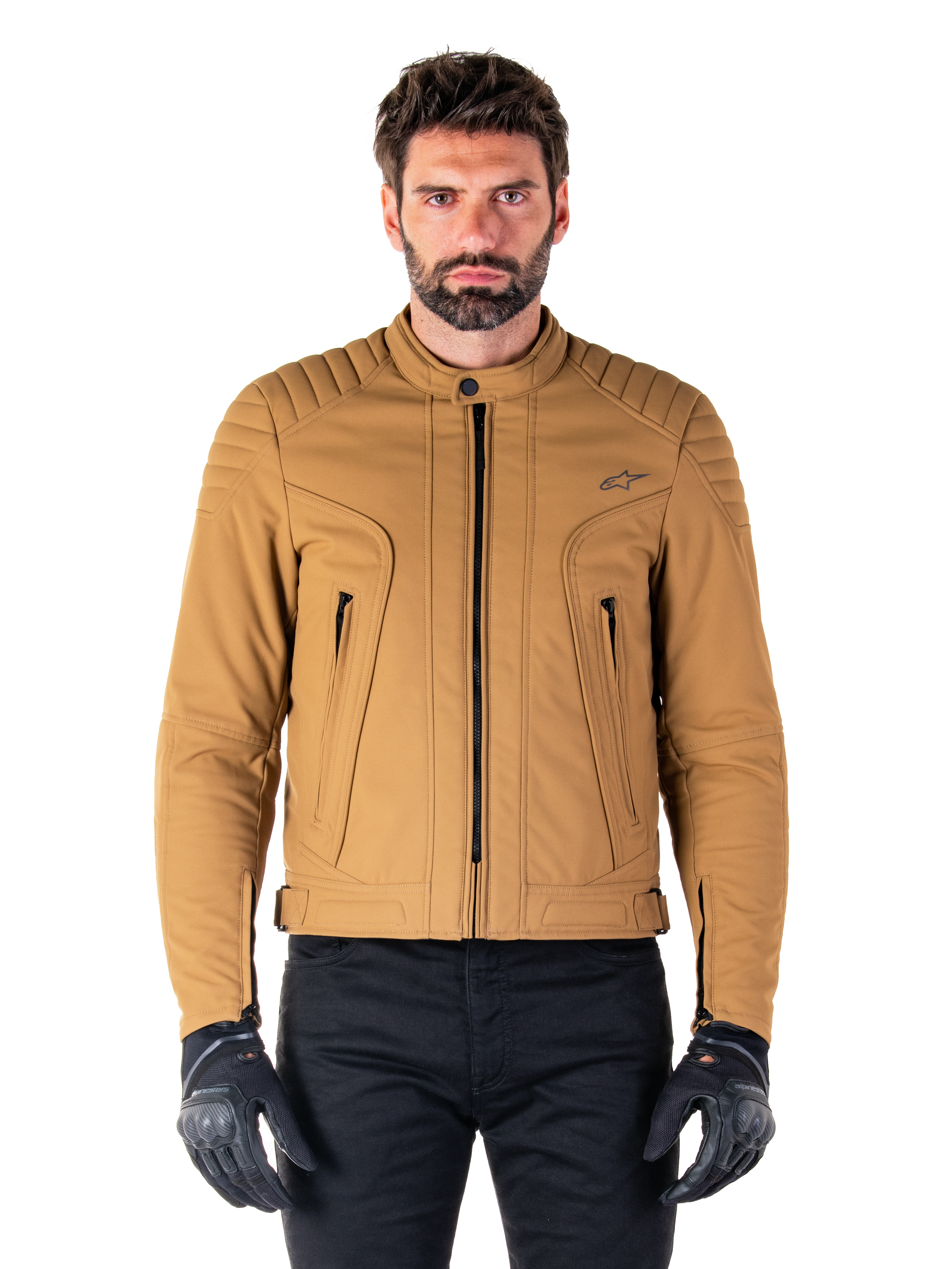 Alpinestars Clayton WR Jacket, Urban Motorcycle Jacket, Utility Brown Light Gold, water-resistant textile with quilted padded shoulders, high biker collar, black zipper details, and chest logo, worn with black protective gloves and pants