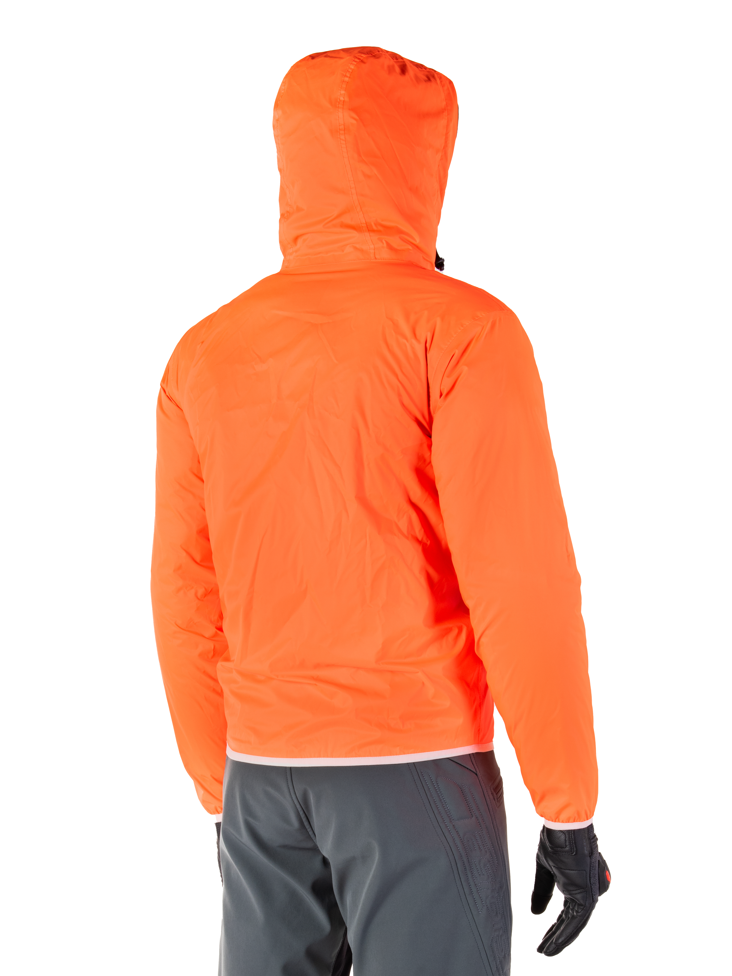 Alpinestars Mohobbs Waterproof Jacket, packable emergency rain liner in bright Orange Fluo, rear view showing stormproof hood, worn with dark grey riding pants and black gloves, lightweight waterproof urban motorcycle gear