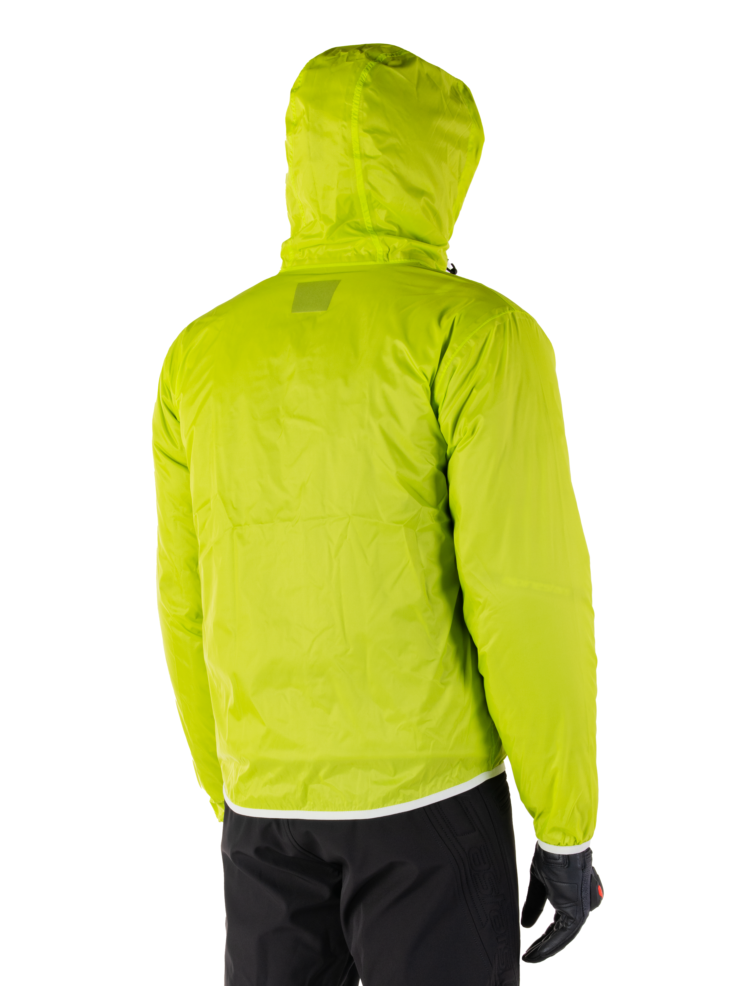 Alpinestars Mohobbs Waterproof Jacket, packable rain liner in Lime Punch, rear view of the hooded neon green waterproof layer, worn with black motorcycle pants and gloves