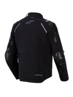 Alpinestars Andes Pro Drystar® XF Jacket, Rear View, Black and Dark Gray, Adventure Touring Textile Jacket featuring a large rear storage pocket, reflective shoulder accents, Alpinestars logo, and Tech-Air® compatibility branding.