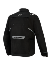 Alpinestars Cusco Drystar® Jacket, Black, Back View, featuring white star logo on the upper back, reflective Alpinestars wordmark on the lower back, large zippered ventilation panel, and durable textile construction for adventure touring
