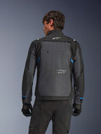 Alpinestars Cusco Drystar® Jacket, Motorcycle Jacket, Black and Deep Gray, back view on a model showing large gray rear panel, white Alpinestars logo, and blue accents on sleeves.