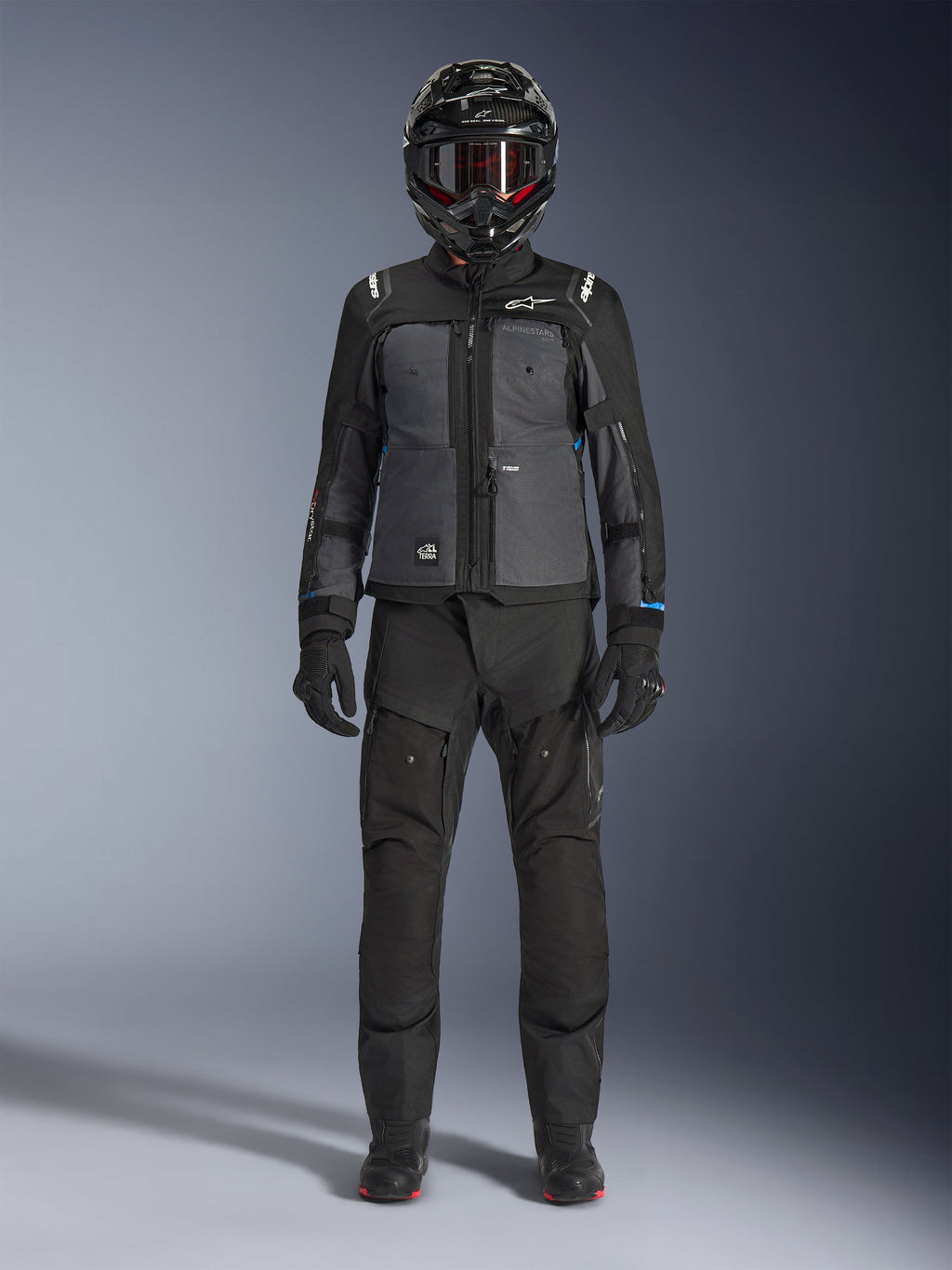 Alpinestars Cusco Drystar® Jacket, Black and Deep Gray adventure touring jacket, worn with matching black pants, gloves, and a full-face helmet, front full-body view, protective motorcycle apparel
