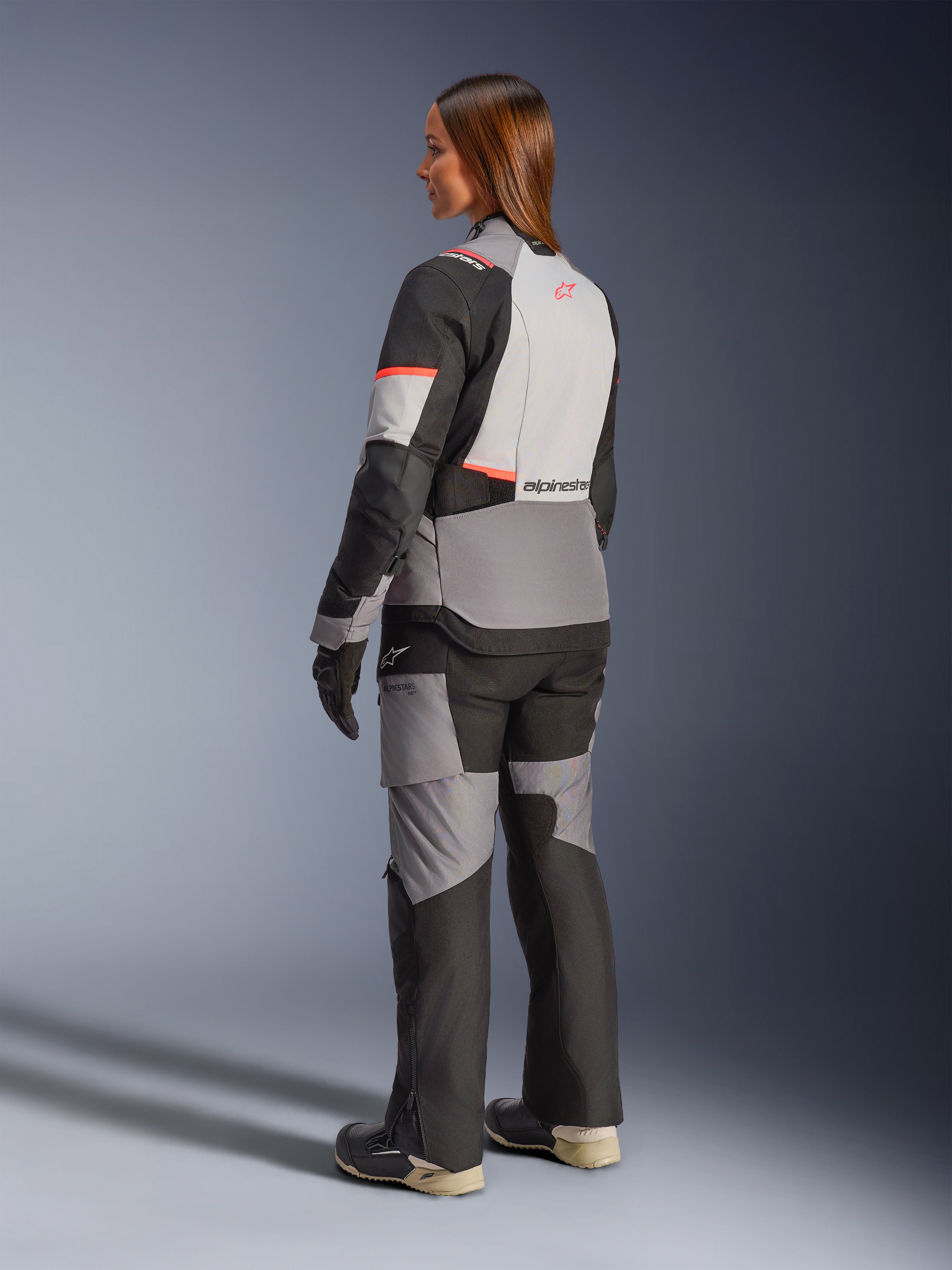 Alpinestars Stella Andes V4 Drystar Jacket, Women's gray/black waterproof adventure jacket with coral accents, rear view.