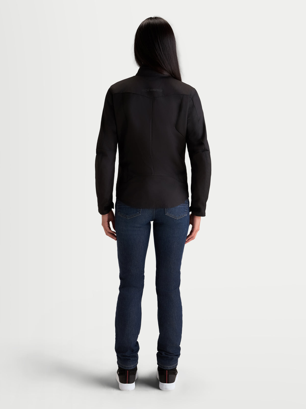 Alpinestars Stella C-1 Waterproof Jacket, women's urban motorcycle textile jacket, black, rear view showing ergonomic 3D back construction and waterproof 450D polyfabric shell worn by a model.