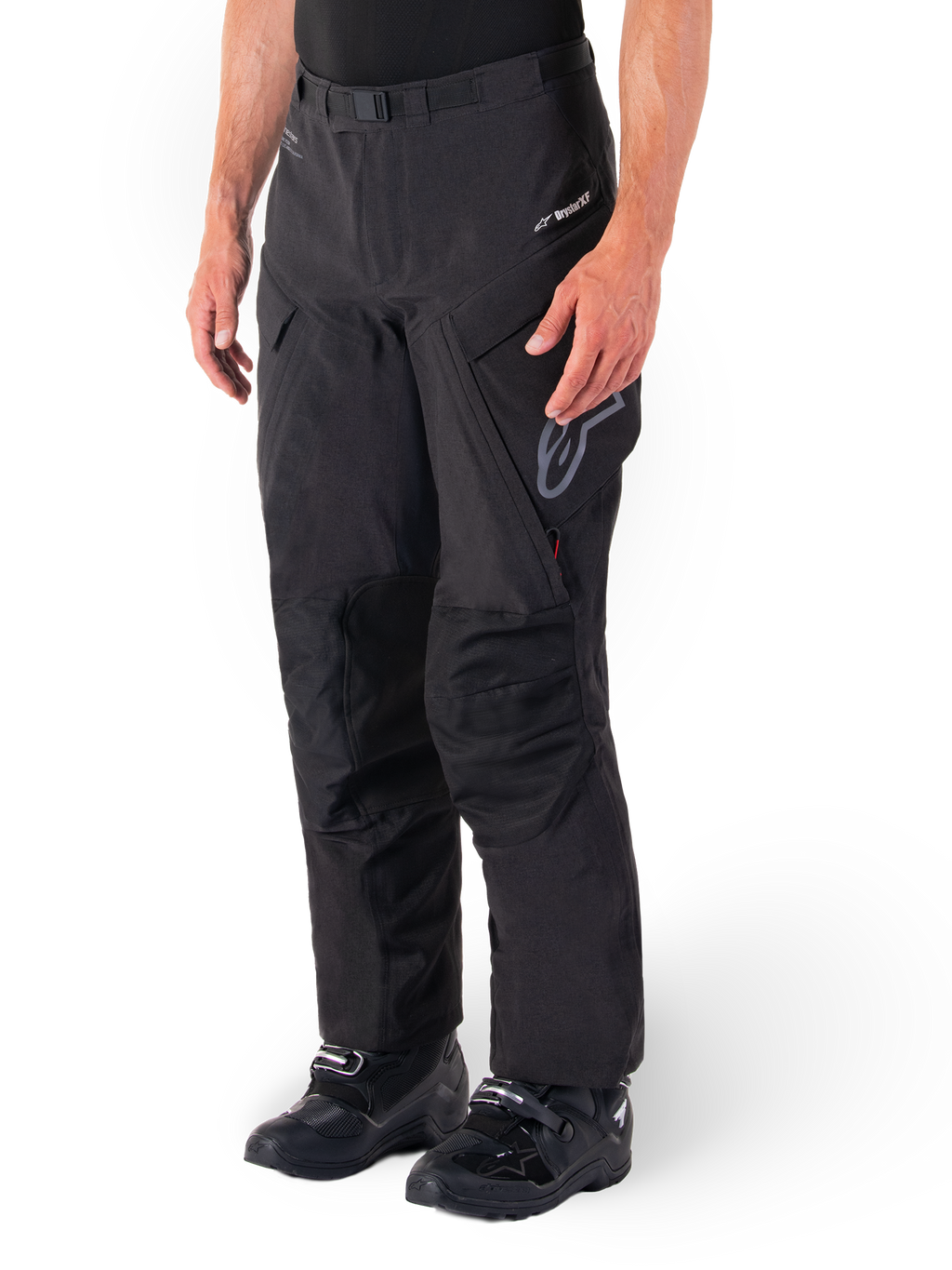 Alpinestars Hyde XT Drystar® Pants, Adventure Touring Motorcycle Pants, Black, worn with black boots, featuring laminated Drystar®XF membrane branding, reinforced knee panels, and zippered cargo pockets.