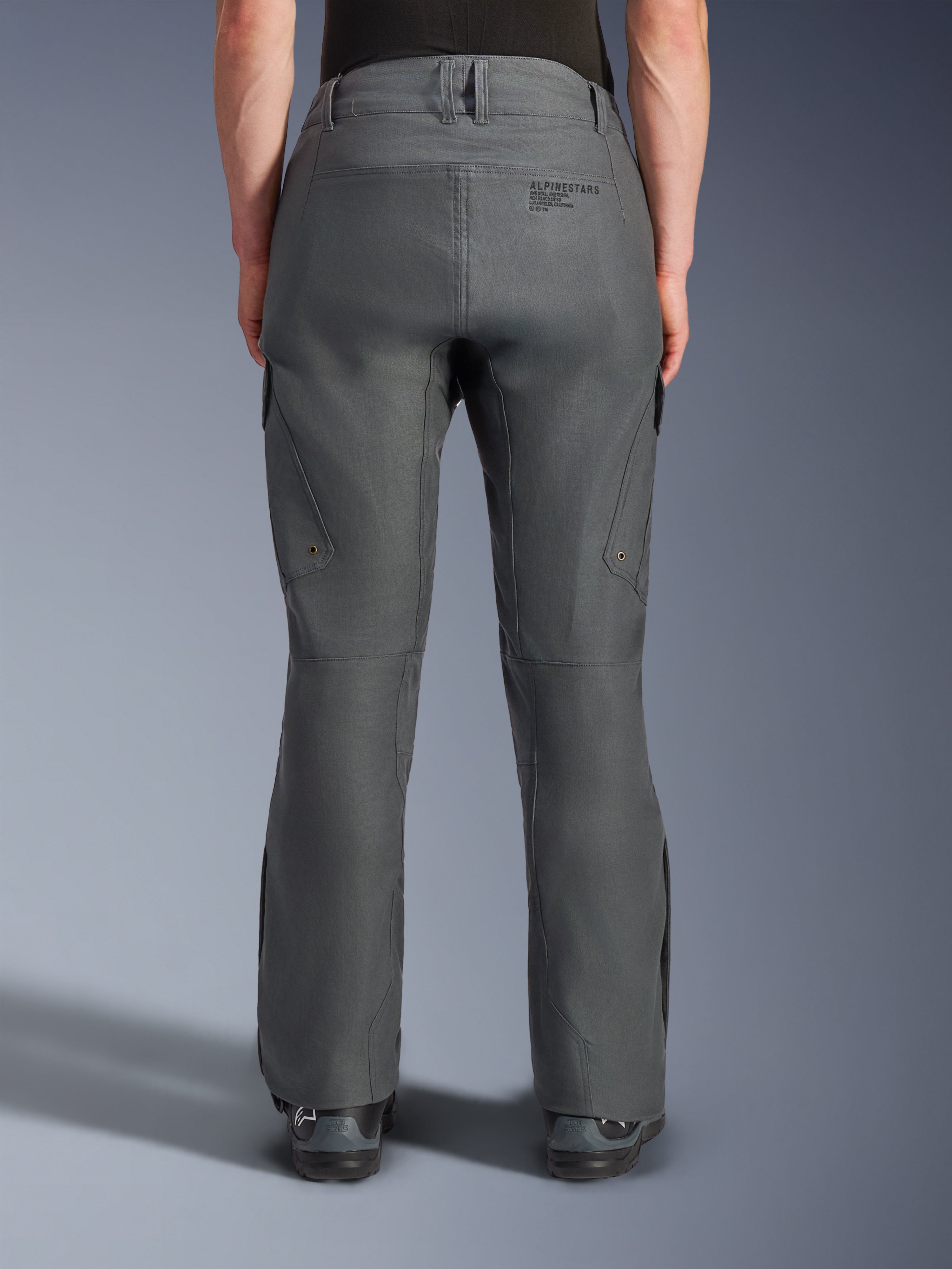 Alpinestars Borrego Drystar® Pants, Adventure Motorcycle Pants, Gray Anthracite, rear view showing textile construction with a waxed-canvas appearance, features Alpinestars branding on the back, cargo pockets, and belt loops, durable and rugged design for adventure riding