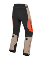 Alpinestars Halo Pro Drystar® XF Laminated Pants, Walnut Rust and Black, rear view of adventure motorcycle pants, featuring walnut tan and black panels with rust orange accents, adjustable calf straps, and durable construction for all-terrain riding.