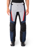 Alpinestars ST-1 Waterproof Pants, Motorcycle Touring Pants, Dark Blue and Light Gray with Bright Red Accents, Black Reinforced Knee Panels, Front View Worn with Black Boots, Waterproof Adventure Touring Gear