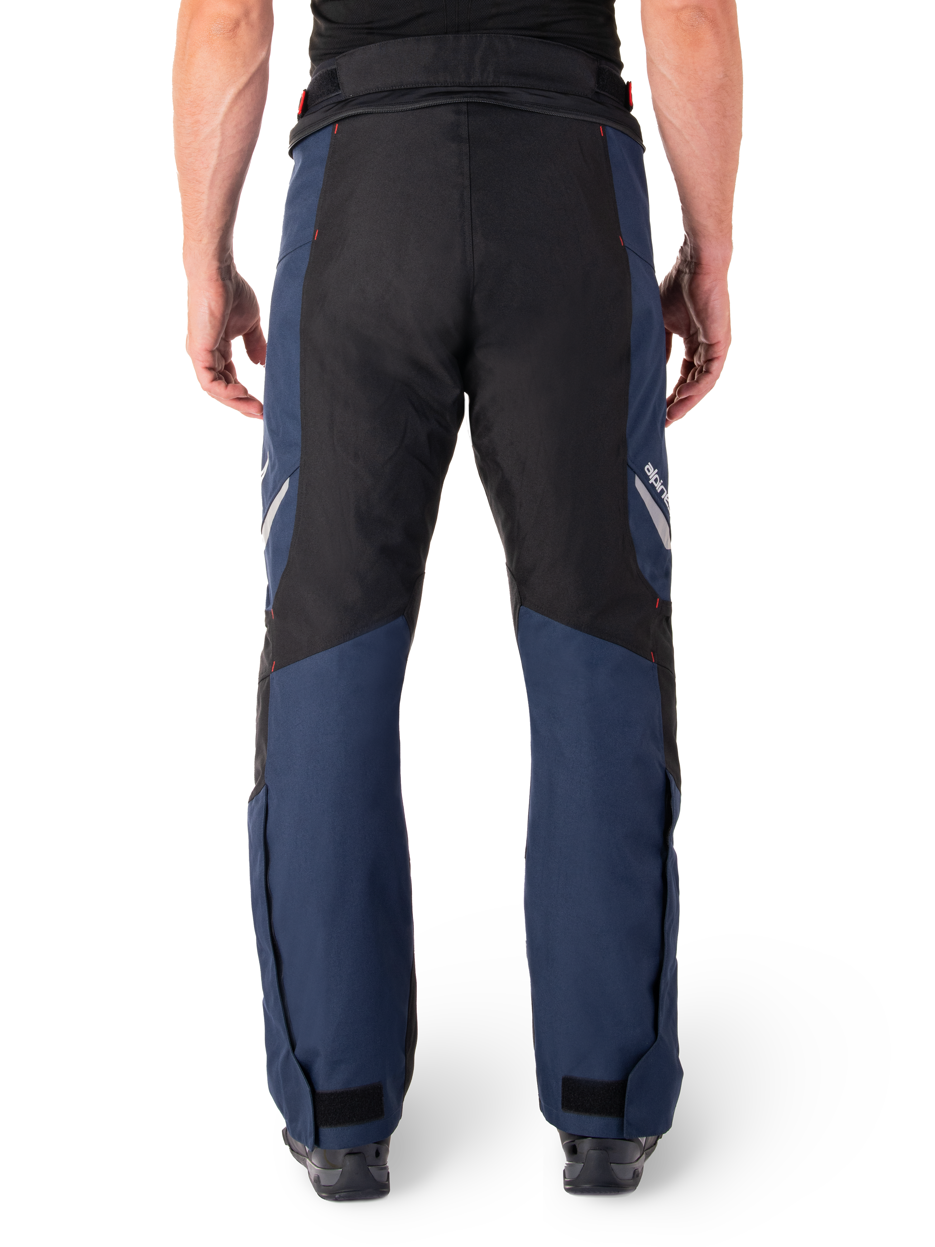 Alpinestars St-1 Waterproof Pants, Motorcycle Touring Pants, Dark Blue and Black with Bright Red accents, rear view, streamlined touring design featuring durable textile construction, reflective branding, and adjustable ankle closures.