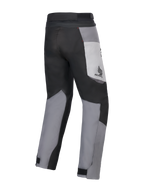 Alpinestars Honda St-1 Waterproof Pants, Motorcycle Touring Pants, Ice Gray, Dark Gray, and Black, rear view showing multi-panel textile design, Honda logo on the thigh, and adjustable ankle closures for all-weather riding.
