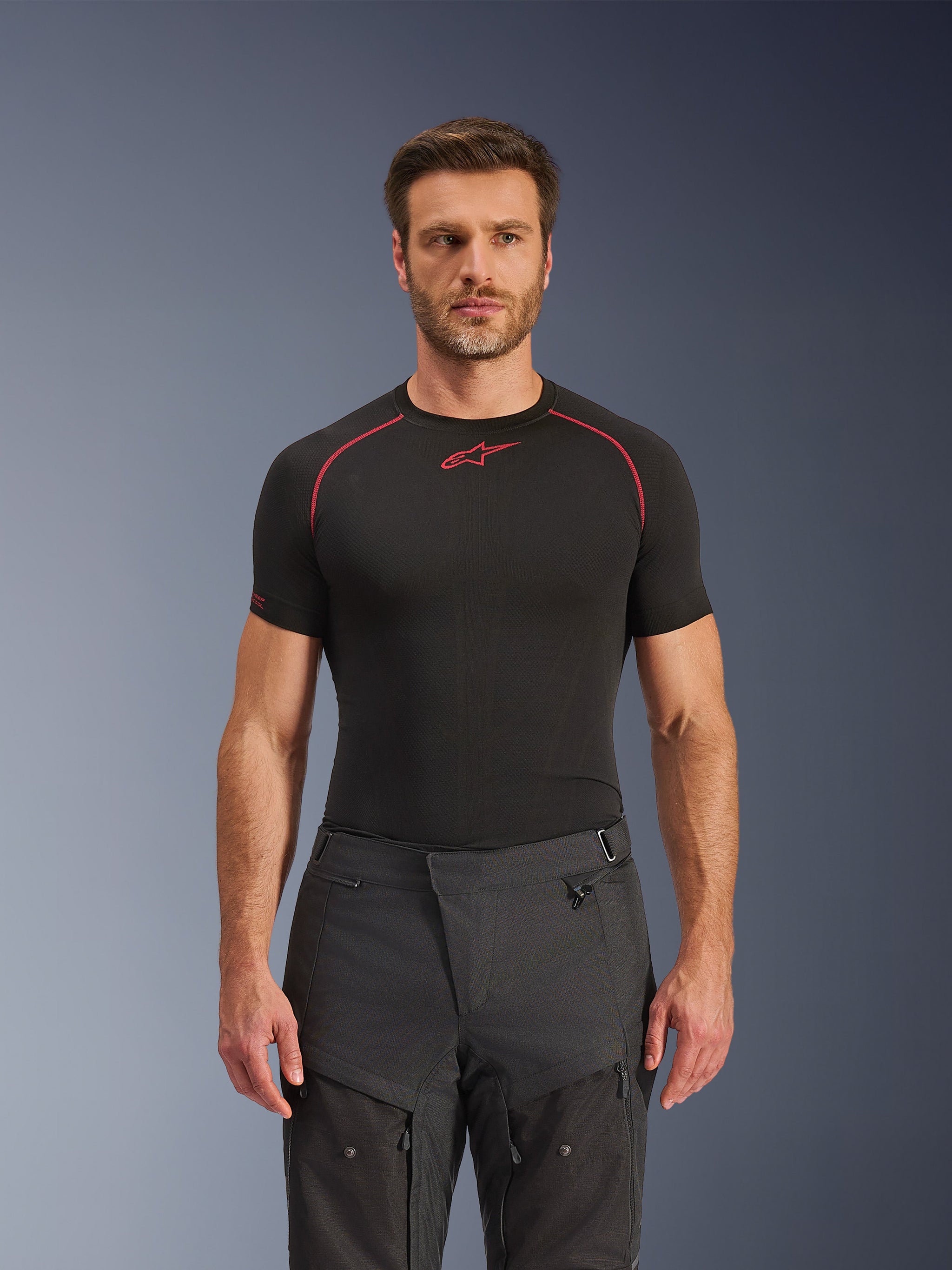 Alpinestars Cusco Drystar® Pants, Adventure Motorcycle Pants, Black, technical textile construction with zippered ventilation and ripstop panels, worn by a male model with a black Alpinestars base layer shirt for a complete adventure riding look