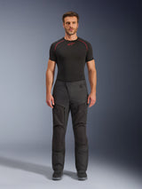 Alpinestars Cusco Drystar® Pants, Textile Motorcycle Pants, Black, worn by a model with a black base layer and boots, adventure touring design with zippered thigh ventilation panels and durable multi-panel construction
